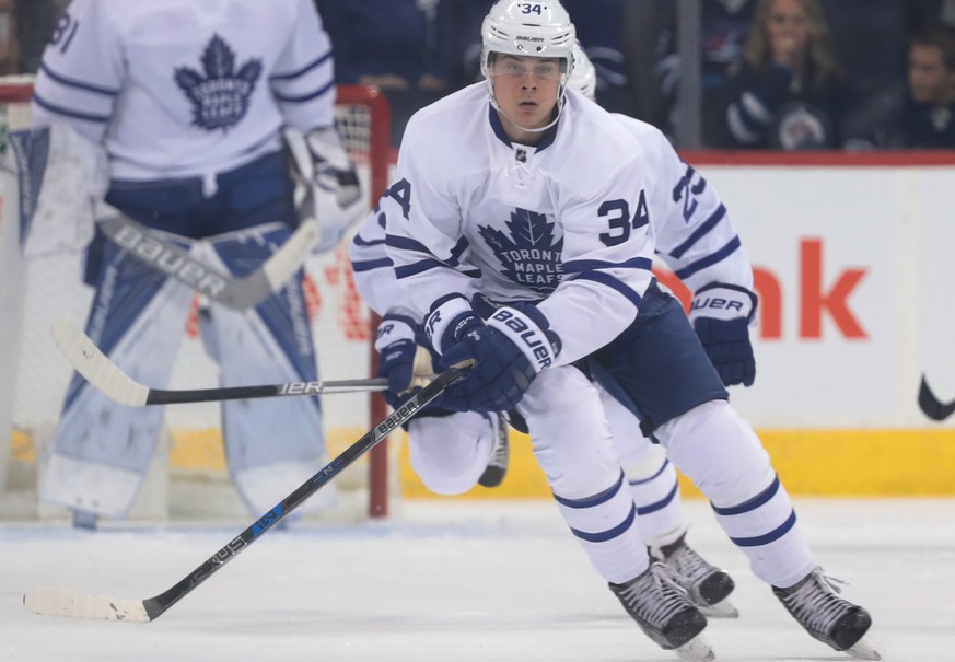 Oct 19, 2016; Winnipeg, Manitoba, CAN; Toronto Maple Leafs center Auston Matthews (34) skates the puck during the first period against Winnipeg Jets at MTS Centre. Mandatory Credit: Bruce Fedyck-USA T ...