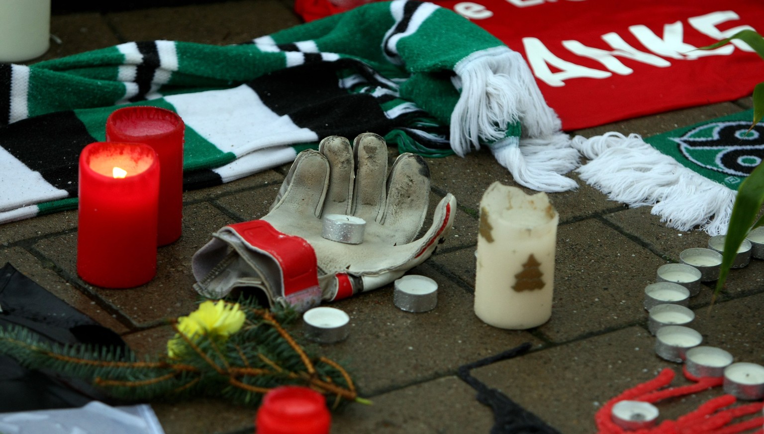 HANOVER, GERMANY - NOVEMBER 11: A goalkeeper glove is laid down in front of the AWD Arena on November 11, 2009 in Hanover, Germany. Enke, 32, goalkeeper for Hannover 96 and the German national team, w ...