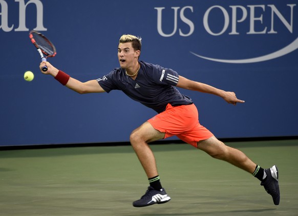 Dominic Thiem, of Austria, stretches to return the ball against Kevin Anderson, of South Africa, in the third round at the U.S. Open tennis tournament on Saturday, Sept. 5, 2015, in New York. Anderson ...