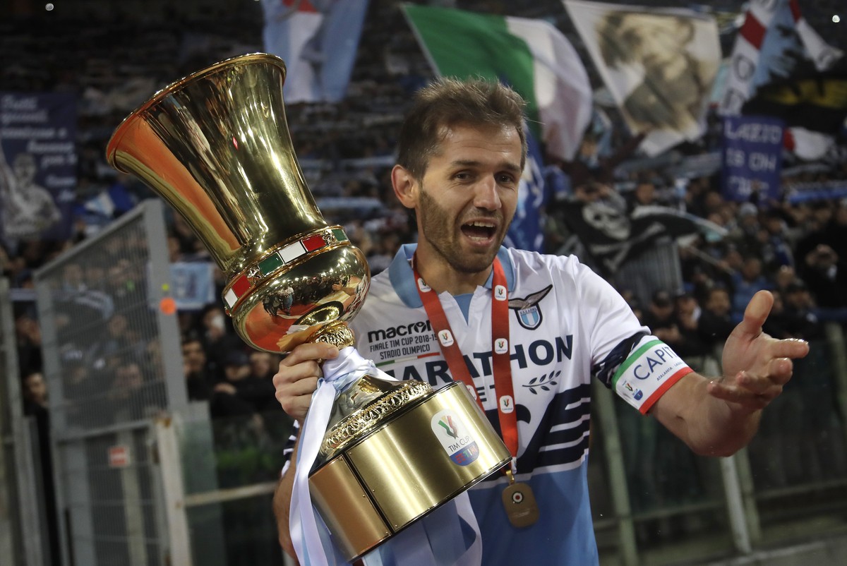 Lazio's Senad Lulic poses with the Italian Cup trophy at the end of the final match between Lazio and Atalanta, at the Rome Olympic stadium, Wednesday, May 15, 2019. (AP Photo/Alessandra Tarantin ...