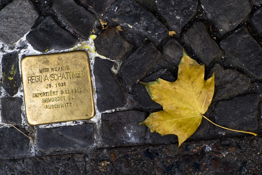 A so-called &#039;Stolperstein&#039; (stumbling stone), commemorating Regina Schattner, is photographed in Berlin, Germany, Thursday, Nov. 8, 201 at the eve of the 80th anniversary of the Nov. 9, 1938 ...