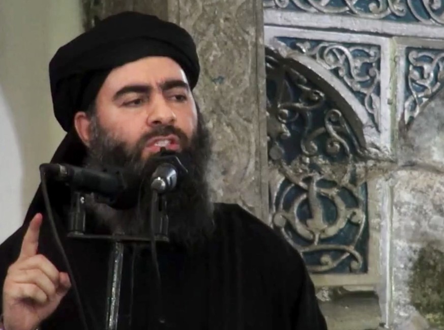 FILE - This file image made from video posted on a militant website Saturday, July 5, 2014, purports to show the leader of the Islamic State group, Abu Bakr al-Baghdadi, delivering a sermon at a mosqu ...