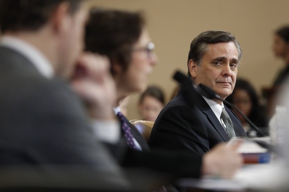 George Washington University Law School professor Jonathan Turley listens to Stanford Law School professor Pamela Karlan testify during a hearing before the House Judiciary Committee on the constituti ...