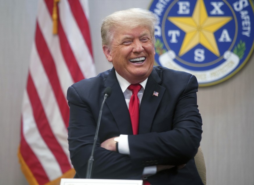 Former President Donald Trump laughs at a joke at a border security briefing at the Texas DPS Weslaco Regional Office on Wednesday, June 30, 2021, in Weslaco, Texas. (Joel Martinez/The Monitor via AP, ...