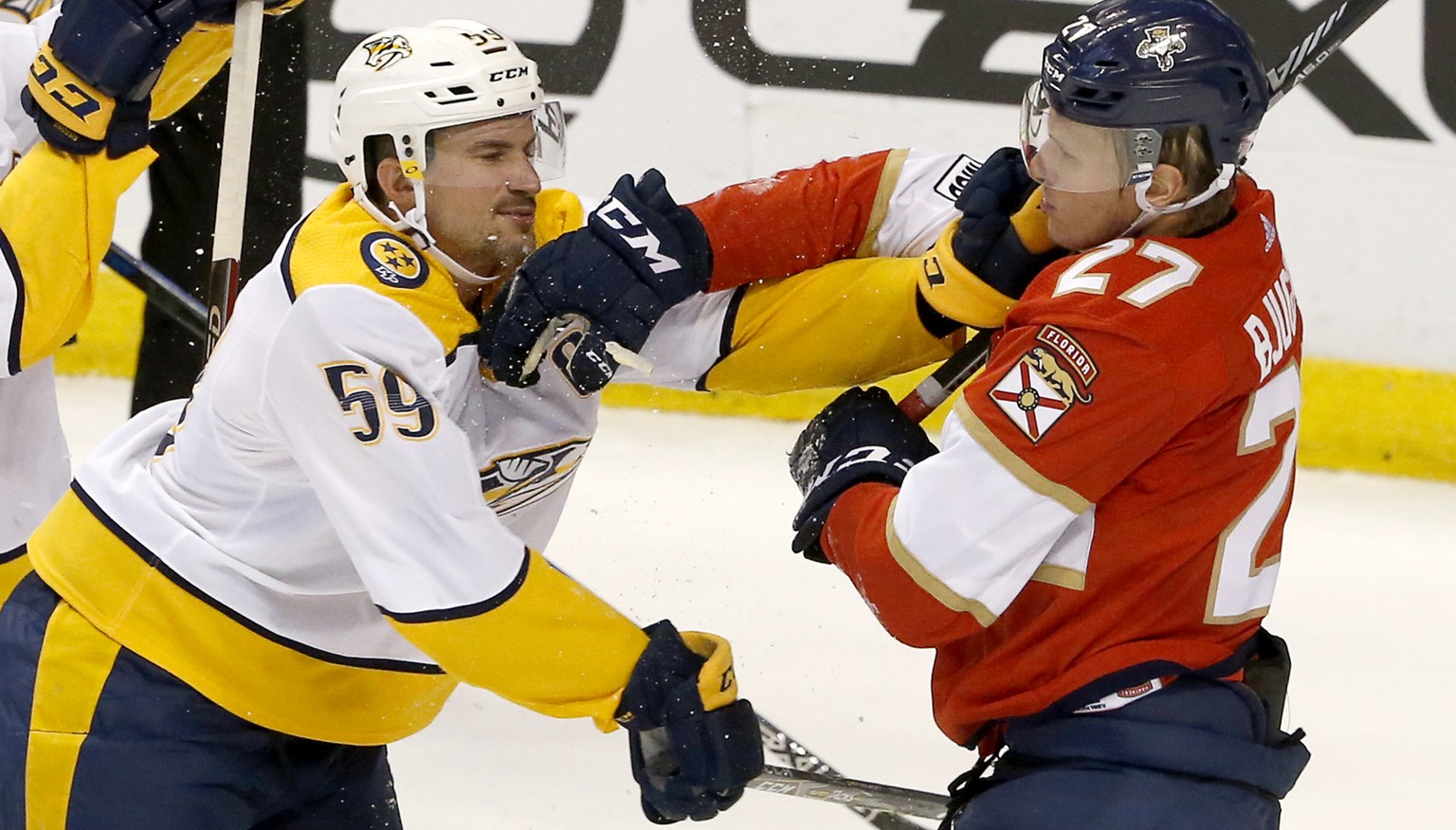 Nashville Predators defenseman Roman Josi (59) and Florida Panthers center Nick Bjugstad (27) fight in the second period in an NHL hockey game, Tuesday, April 3, 2018, in Sunrise, Fla. (AP Photo/Joe S ...