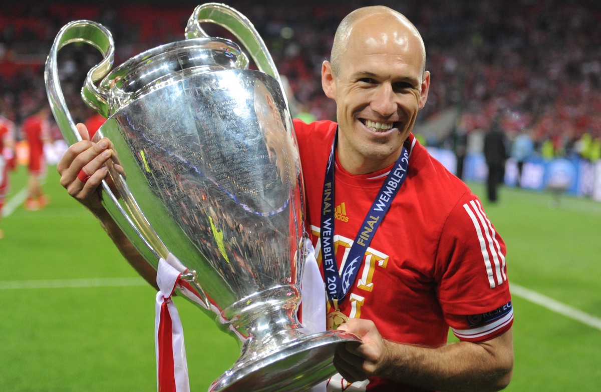 epa07695120 (FILE) Munich's Arjen Robben poses with the trophy after winning the UEFA soccer Champions League final between Borussia Dortmund and Bayern Munich at Wembley stadium in London, Engla ...