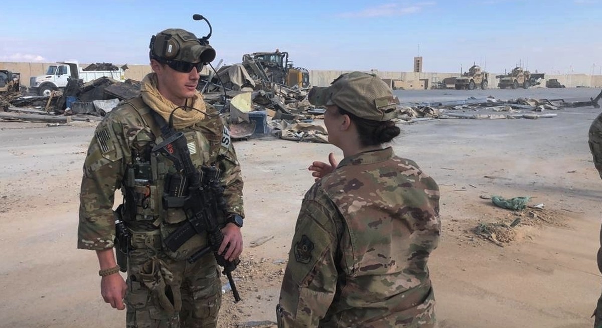 U.S. Soldiers stand near the site of Iranian bombing at Ain al-Asad air base in Anbar, Iraq, Monday, Jan. 13, 2020. Ain al-Asad air base was struck by a barrage of Iranian missiles on Wednesday, in re ...
