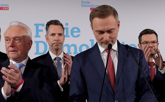 epa11919694 Chairman of the Free Democratic Party (FDP) and former German Finance Minister Christian Lindner (2-R) and Deputy Chairman of the FDP, Wolfgang Kubicki (L) attend the Free Democratic Party ...