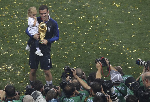 France&#039;s Antoine Griezmann poses with the trophy at the end of the final match between France and Croatia at the 2018 soccer World Cup in the Luzhniki Stadium in Moscow, Russia, Sunday, July 15,  ...