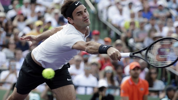 Roger Federer, of Switzerland, goes to the net against Thanasi Kokkinakis, of Australia, during the Miami Open tennis tournament, Saturday, March 24, 2018, in Key Biscayne, Fla. (AP Photo/Lynne Sladky ...