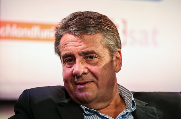 epa07089978 German former foreign minister Sigmar Gabriel speaks at the authors&#039; forum &#039;Blue Sofa&#039; during the book fair &#039;Frankfurter Buchmesse 2018&#039;, in Frankfurt am Main, Ger ...