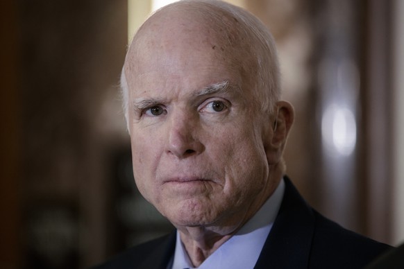 FILE - In this Oct. 25, 2017 file photo, Senate Armed Services Chairman John McCain, R-Ariz., pauses before speaking to reporters during a meeting of the National Defense Authorization Act conferees,  ...