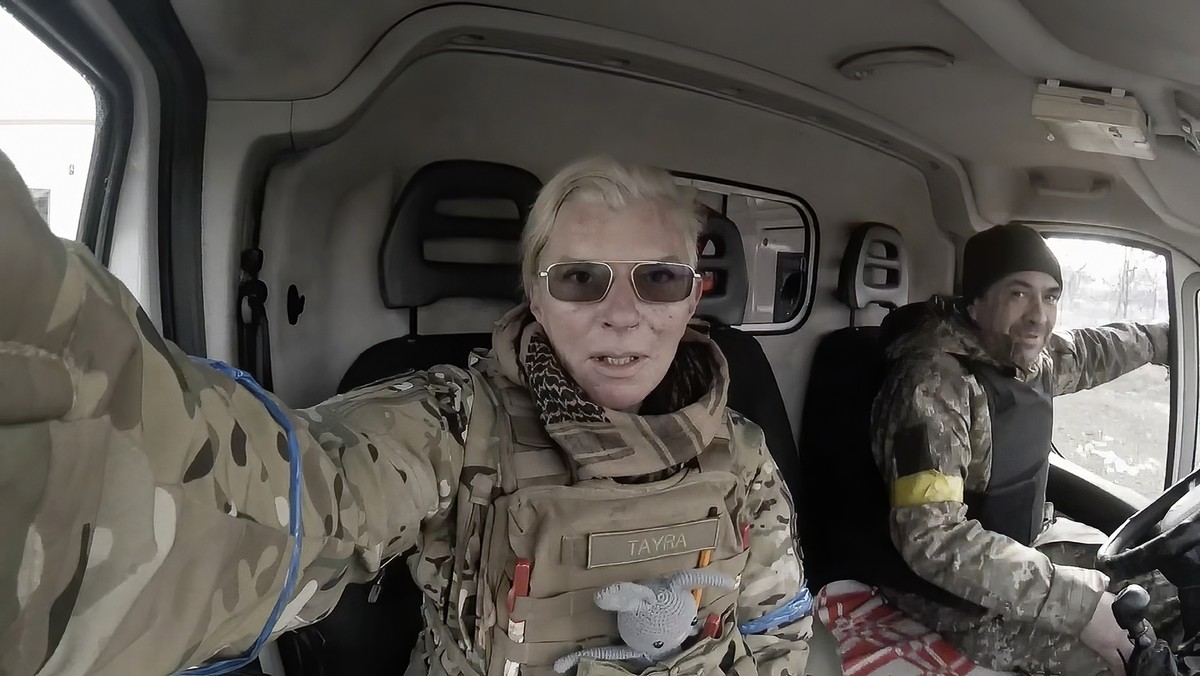 Yuliia Paievska, known as Taira, and her driver Serhiy sit in a vehicle in Mariupol, Ukraine on March 9, 2022. She last appeared on March 21 on Russian television as a captive, handcuffed and with bru ...