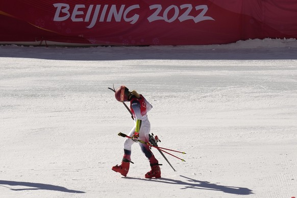 Mikaela Shiffrin of United States leaves the finish area after racing in a semifinal of the mixed team parallel skiing event at the 2022 Winter Olympics, Sunday, Feb. 20, 2022, in the Yanqing district ...