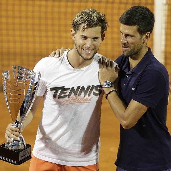 epa08485666 Novak Djokovic (R) of Serbia congratulates the winner Dominic Thiem of Austria after the final match against Filip Krajinovic of Serbia at the Adria Tour tennis tournament in Belgrade, Ser ...