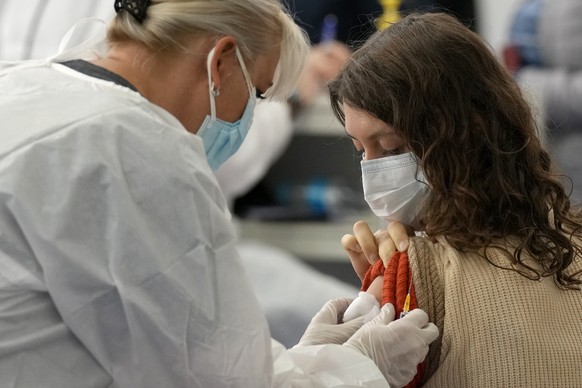 A woman from Russia is administered a dose of the Johnson COVID-19 vaccine in Zagreb, Croatia, Tuesday, Nov. 9, 2021. Despite its infection surge, Croatia is becoming a new favored destination for Rus ...