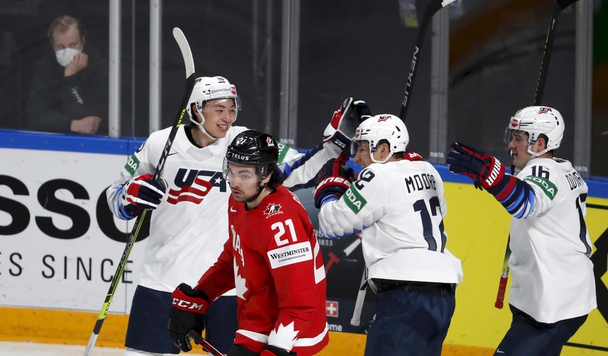 epa09223789 Jason Robertson (L), Trevor Moore and Ryan Donato (R) of USA celebrate a goal during the IIHF 2021 World Ice Hockey Championships group B match between Canada and USA at the Arena Riga, La ...
