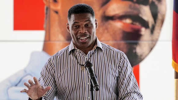 FILE - Republican candidate for U.S. Senate Herschel Walker speaks during a campaign stop in Dawsonville, Ga., Oct. 25, 2022. A woman came forward Wednesday, Oct. 26, to accuse Walker of encouraging a ...