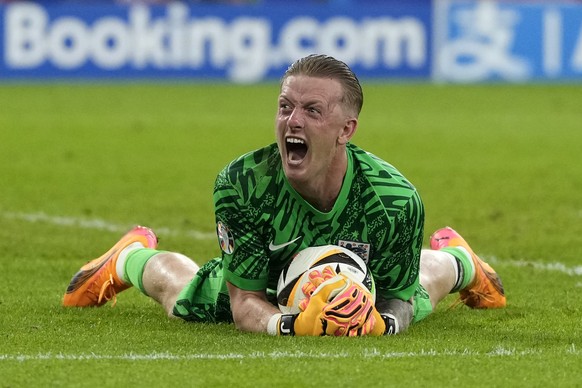 England&#039;s goalkeeper Jordan Pickford celebrates at the end of the round of sixteen match between England and Slovakia at the Euro 2024 soccer tournament in Gelsenkirchen, Germany, Sunday, June 30 ...