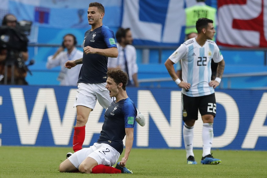 France&#039;s Benjamin Pavard, center, celebrates after scoring his side&#039;s second goal with teammate France&#039;s Lucas Hernandez, top, during the round of 16 match between France and Argentina, ...