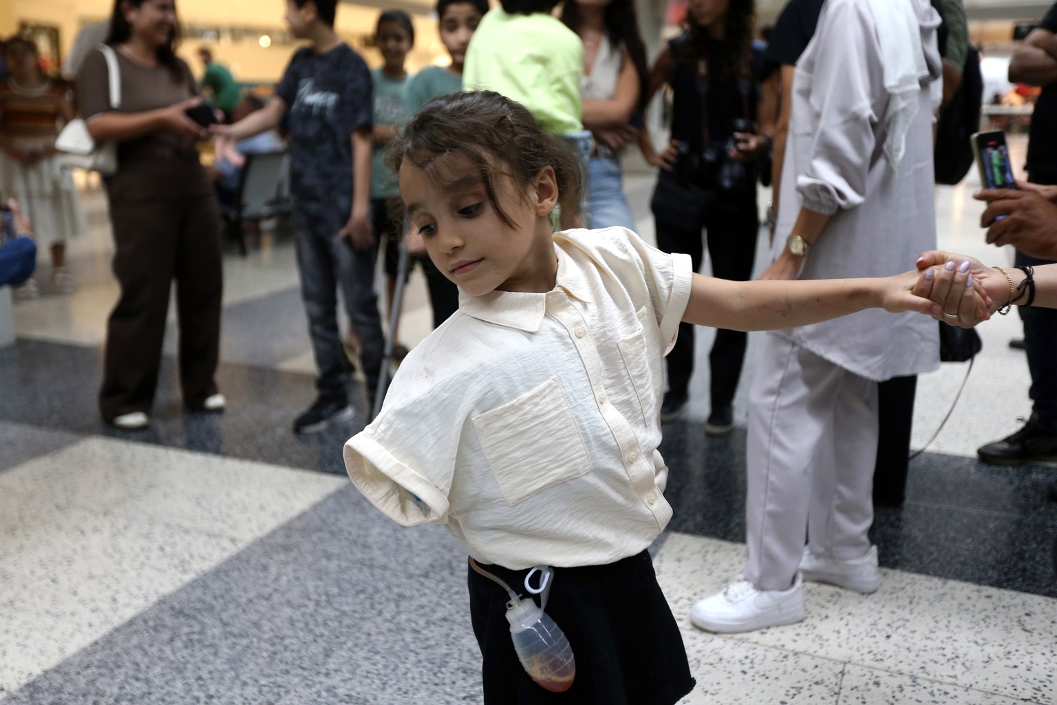 epaselect epa12346822 Members of six Palestinian families with wounded children from the Gaza Strip arrive at Rafic Hariri International Airport for medical treatment in Beirut, Lebanon, 02 September  ...