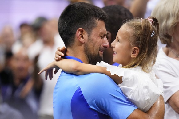 Novak Djokovic, of Serbia, celebrates with his daughter Tara after defeating Daniil Medvedev, of Russia, in the men&#039;s singles final of the U.S. Open tennis championships, Sunday, Sept. 10, 2023,  ...