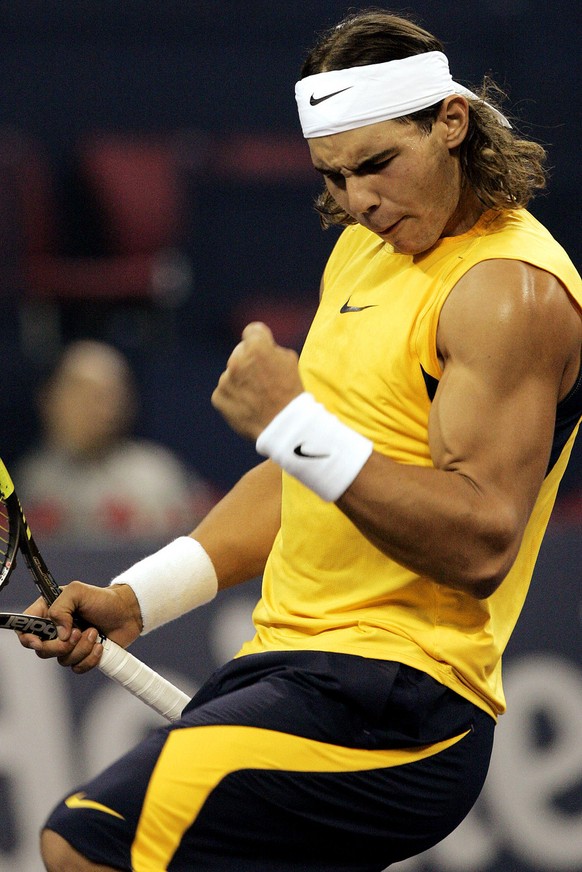 Rafael Nadal of Spain returns reacts after winning a point against James Blake of U.S. at the Tennis Masters Cup Monday, Nov. 13, 2006 at Qizhong Stadium in Shanghai, China. (AP Photo/Eugene Hoshiko)