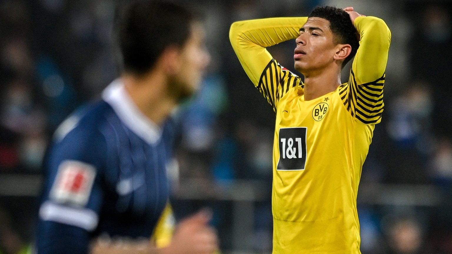 epa09636768 Dortmund&#039;s Jude Bellingham reacts during the German Bundesliga soccer match between VfL Bochum and Borussia Dortmund at Ruhrstadion in Bochum, Germany, 11 December 2021. EPA/SASCHA ST ...