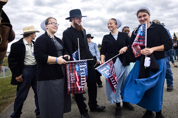 epa10288786 Members of the Old Order Amish community gather for a political rally with former President Donald Trump and Pennsylvania Republican Senate candidate Mehmet Oz in Latrobe, Pennsylvania…