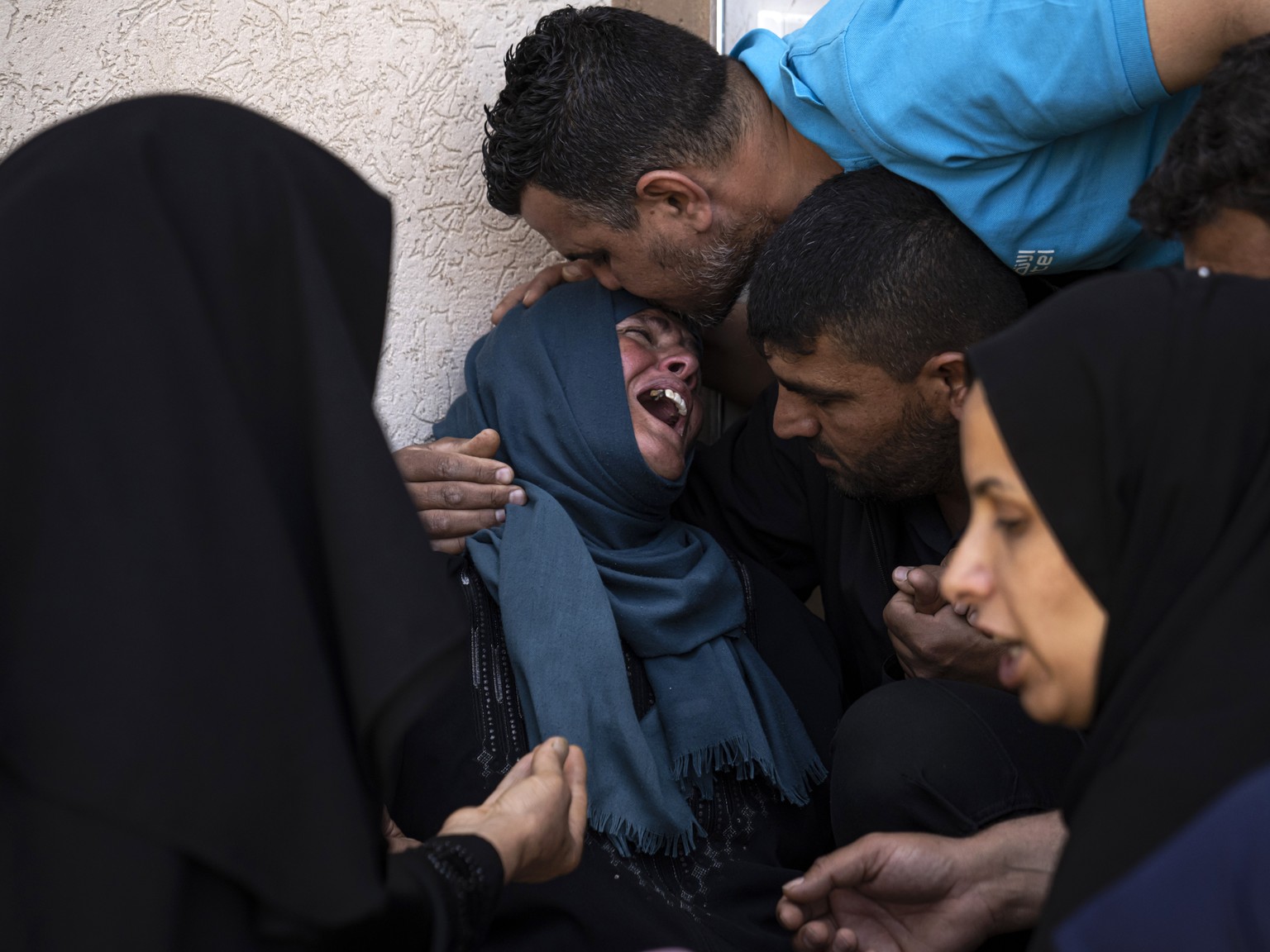 Palestinians mourn Mohammed Abu Taima, killed in an Israeli airstrike, in Khan Younis in the Gaza Strip, Wednesday, May 10, 2023. Israeli authorities say Palestinian militants in the Gaza Strip ha...
