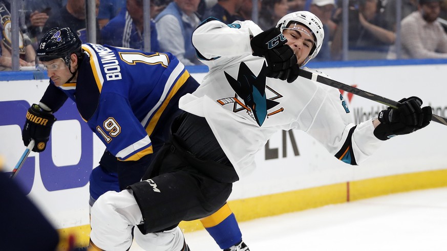 San Jose Sharks right wing Timo Meier, of Switzerland, right, falls as he collides with St. Louis Blues defenseman Jay Bouwmeester (19) during the second period in Game 4 of the NHL hockey Stanley Cup ...