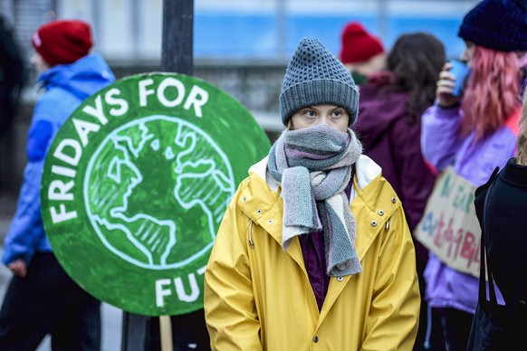 Swedish environmental activist Greta Thunberg attends a climate strike arranged by the organization &quot;Fridays For Future&quot; outside the Swedish parliament Riksdagen in Stockholm, Friday Dec. 20 ...
