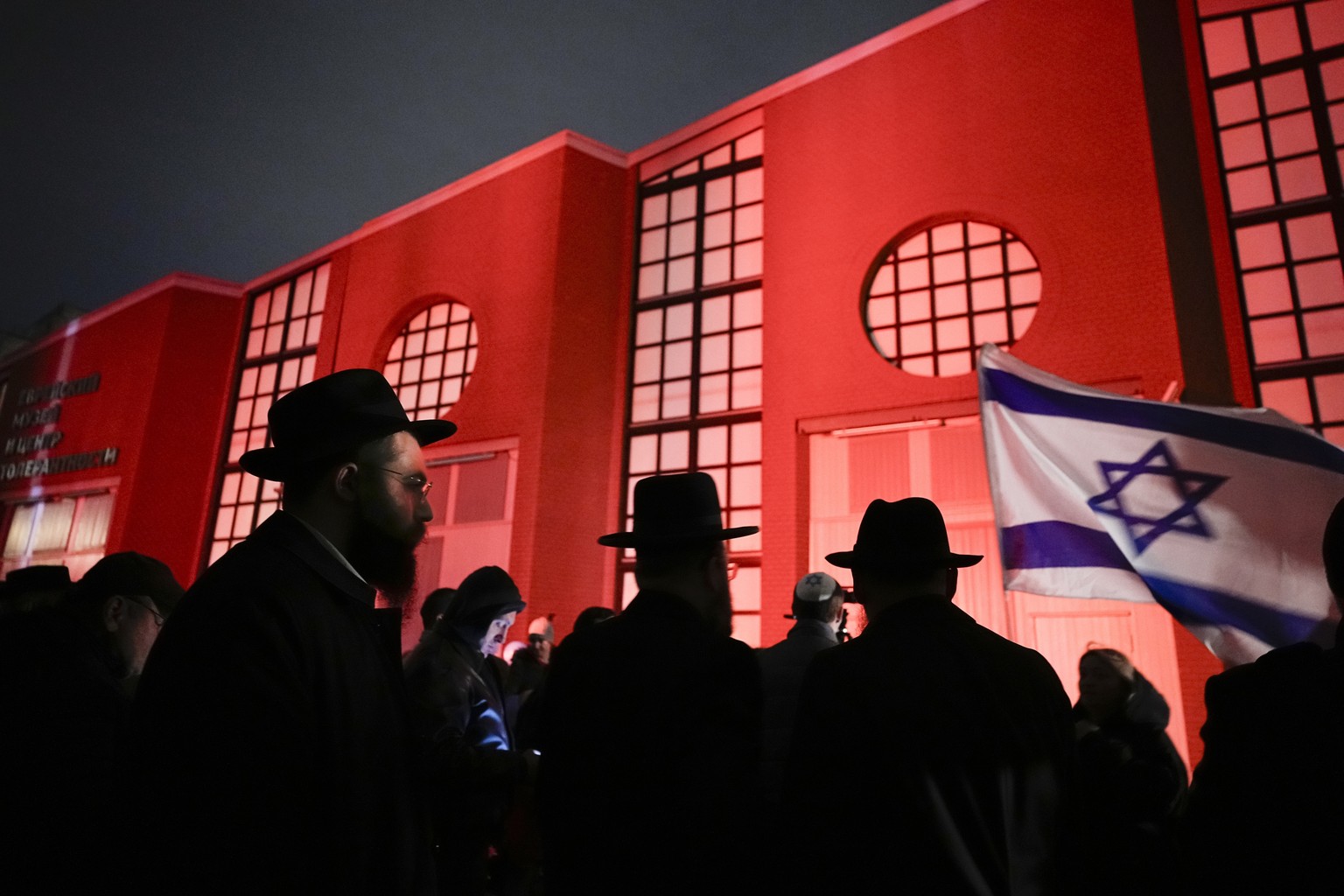 People gather to attend a solidarity service for the Israeli victims of the attacks by the Palestinian militant group Hamas at the Moscow Jewish Museum and Tolerance Center in Moscow, Russia, Sunday,  ...