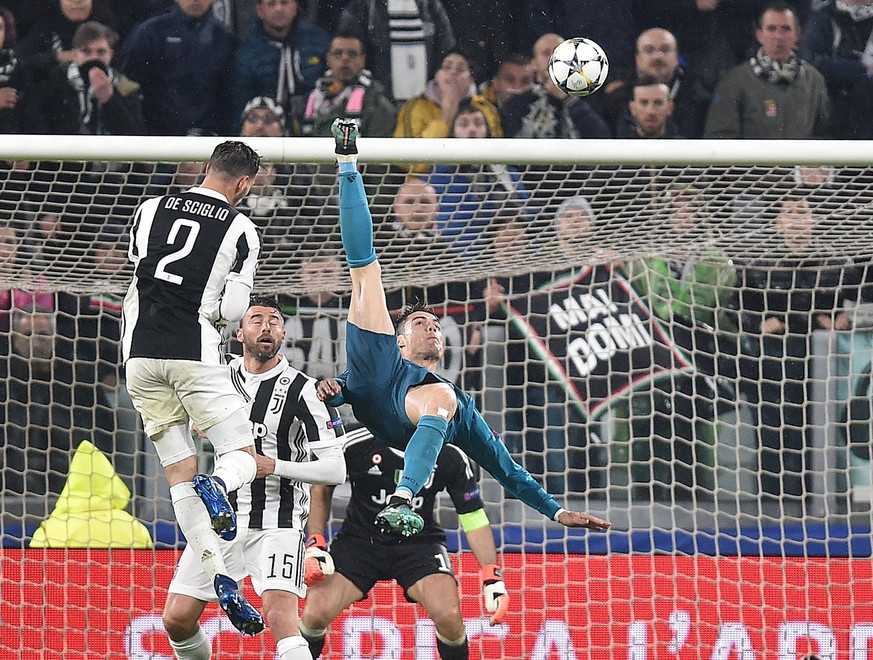 epa06644063 Real Madrid&#039;s Cristiano Ronaldo (R) scores the 2-0 goal during the UEFA Champions League quarter final first leg soccer match between Juventus FC vs Real Madrid CF at Allianz stadium  ...