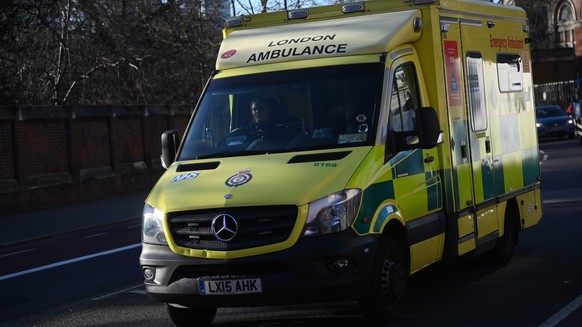 epa09719489 A National Health Service (NHS) ambulance outside St. Thomas Hospital in London, Britain 31 January 2022. Britain&#039;s Ministers are expected to decide whether or not to scrap mandatory  ...