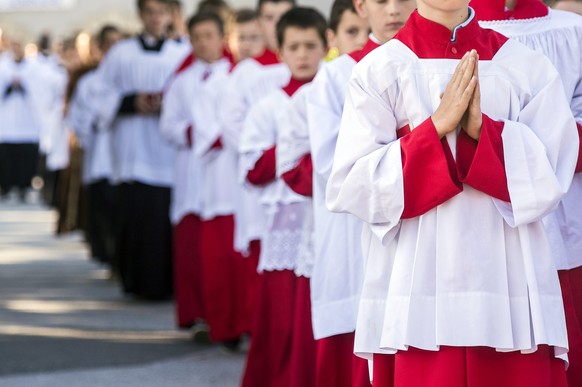 Children walk in a procession before a mass ordination of the breakaway Roman Catholic sect, the Society of St Pius X, in Econe, western Switzerland, June 27, 2014. 8 fundamentalist priests and 7 deac ...