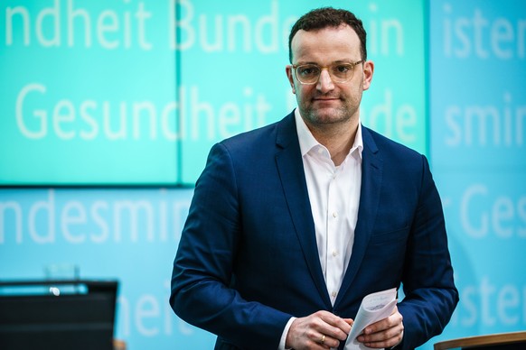 epa08306729 German Health Minister Jens Spahn leaves after a press conference in Berlin, Germany, 19 March 2020. German Health Minister Jens Spahn gave a press conference with the nursing care represe ...