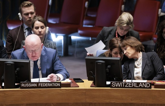 epa10454967 Russia&#039;s Ambassador to the U.N. Vassily Nebenzia (L) speaks as Switzerland?s Ambassador Pascale Baeriswyl (R) listens during a United Nations Security Council meeting called by Russia ...