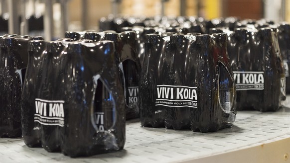 Bottling of the Swiss soft drink Vivi Kola Klassisch, a cola, into 33 cl PET bottles at a bottling plant in Elm, Canton of Glarus, Switzerland, on November 14, 2018. (KEYSTONE/Christian Beutler)