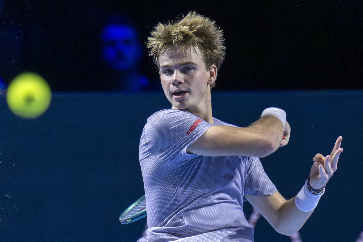 Switzerland's Henry Bernet returns a ball to Czech Republic's Jakub Mensik during their first round match at the Swiss Indoors tennis tournament at the St. Jakobshalle in Basel, Switzerland, ...