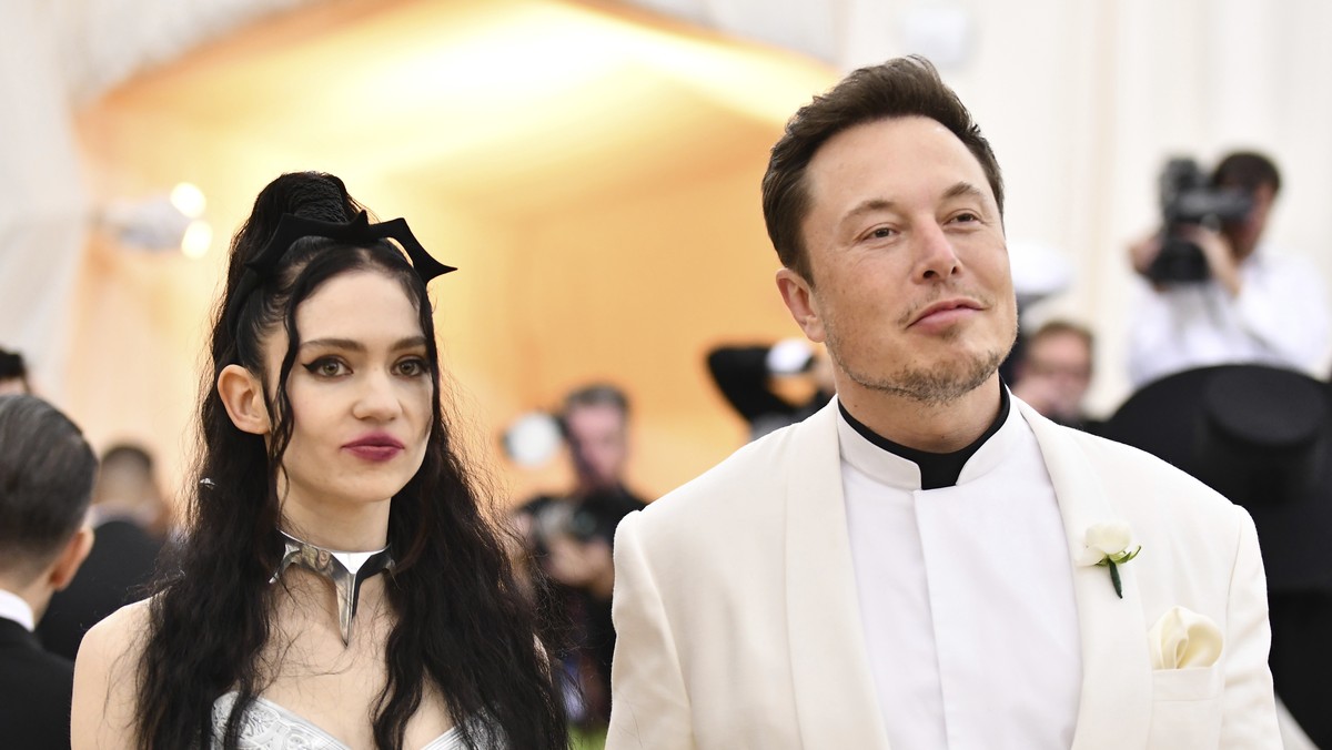 FILE - Grimes, left, and Elon Musk attend The Metropolitan Museum of Art's Costume Institute benefit gala in New York on May 7, 2018. The Tesla and SpaceX founder tells the New York Post that he  ...