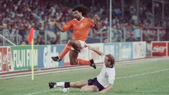 Gullit tackled by Wright. 16th June 1990. The 1990 FIFA World Cup. England v Netherlands (Photo by Albert Cooper/Mirrorpix via Getty Images)
