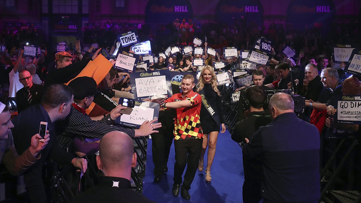 Belgian's Dimitri Van den Bergh on his walk in, during day thirteen of the William Hill World Darts Championship at Alexandra Palace, London, Friday, Dec. 29, 2017. (Adam Davy/PA via AP)