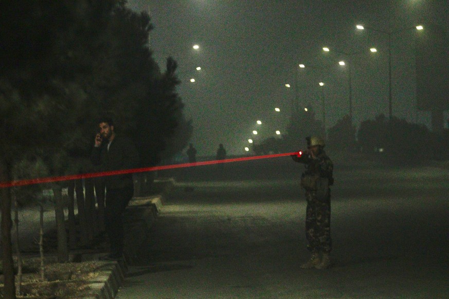 epa06458420 Afghan security officials take up positions near the scene of attack by armed men at an upscale hotel in Kabul, Afghanistan, 20 January 2018. A group of armed insurgents attacked Kabul&#03 ...