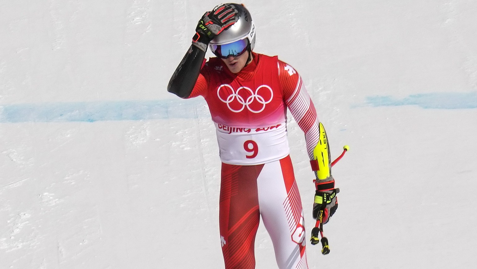 Marco Odermatt of Switzerland reacts as he approaches the finish area of the the men&#039;s super-G at the 2022 Winter Olympics, Tuesday, Feb. 8, 2022, in the Yanqing district of Beijing. (AP Photo/Lu ...