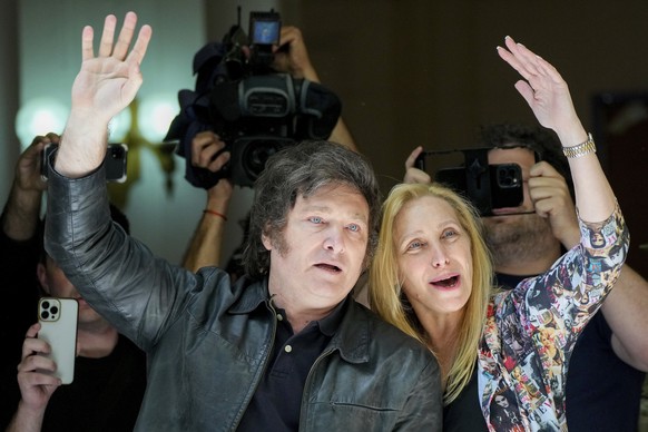 DOES NOT CORRECT NAME TO KARINA MILEI FATIMA FLORES - Presidential candidate of the Liberty Advances coalition Javier Milei waves after the vote, accompanied by his sister Karina Milei, right, in the president ...