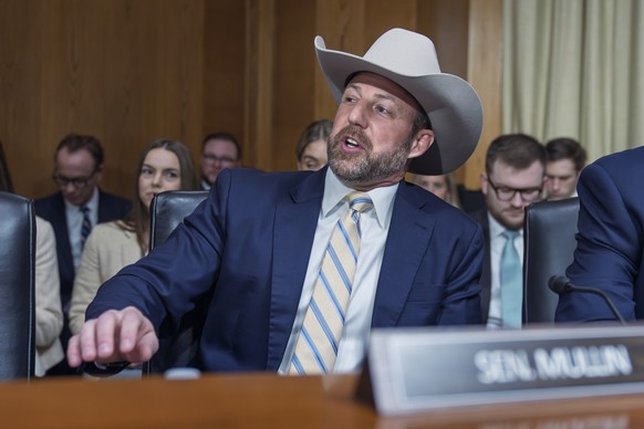 Sen. Markwayne Mullin, R-Okla., wears a cowboy hat as he arrives at the Senate Health, Education, Labor and Pensions (HELP) Committee as the panel considers President Donald Trump's nominations f ...
