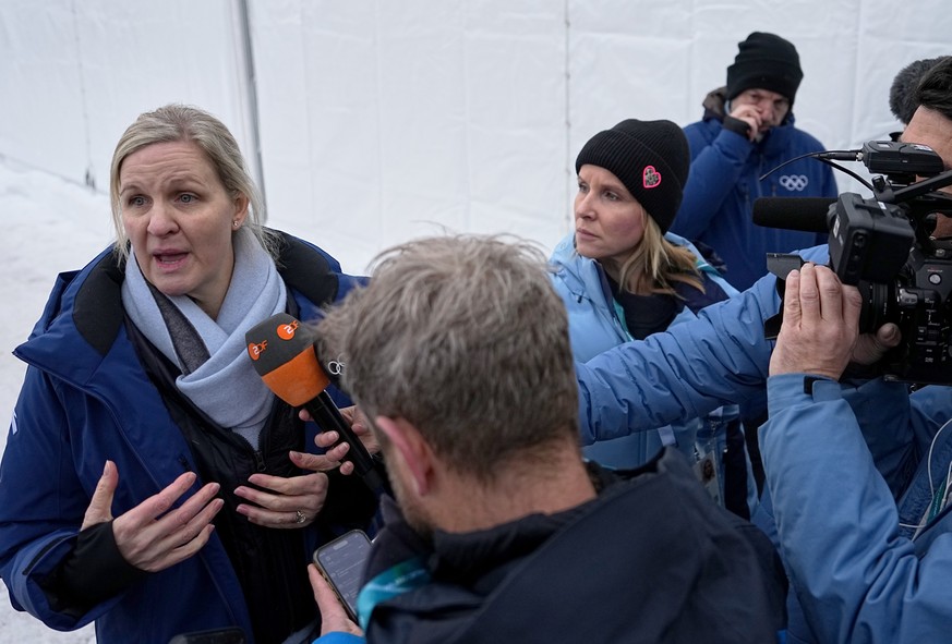 International Olympic Committee President Kirsty Coventry, left, talks to the media at the start house of the sliding center at the 2026 Winter Olympics, in Cortina d'Ampezzo, Italy, Thursday, Fe ...