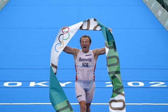 Kristian Blummenfelt of Norway reacts after crossing the finish line to win the gold medal during the men&#039;s individual triathlon at the 2020 Summer Olympics, Monday, July 26, 2021, in Tokyo, Japa ...