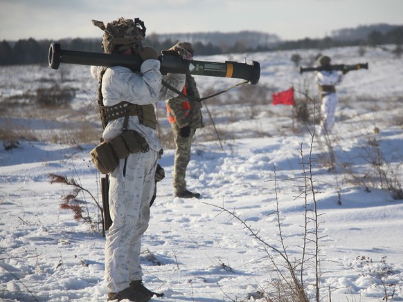 In this photo provided by the Ukrainian Defense Press Service and taken on Jan. 30, 2022, a Ukrainian soldier trains using the US M141 Bunker Defeat Munition (SMAW-D) missiles at the Yavoriv military  ...